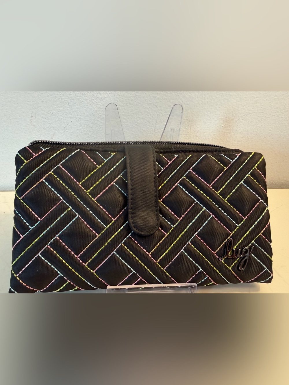 Lug Tram 2 RFID black wallet with rainbow-colored quilted stitching.